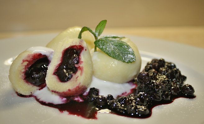 Curd cheese dumplings with blueberry sauce “žahour”